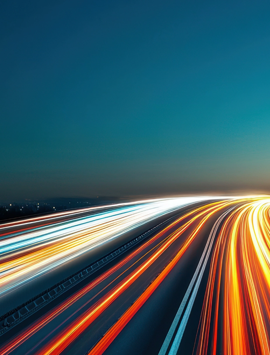 Dynamic highway light trails with orange blue streaks representing India's automotive manufacturer expansion and acceleration