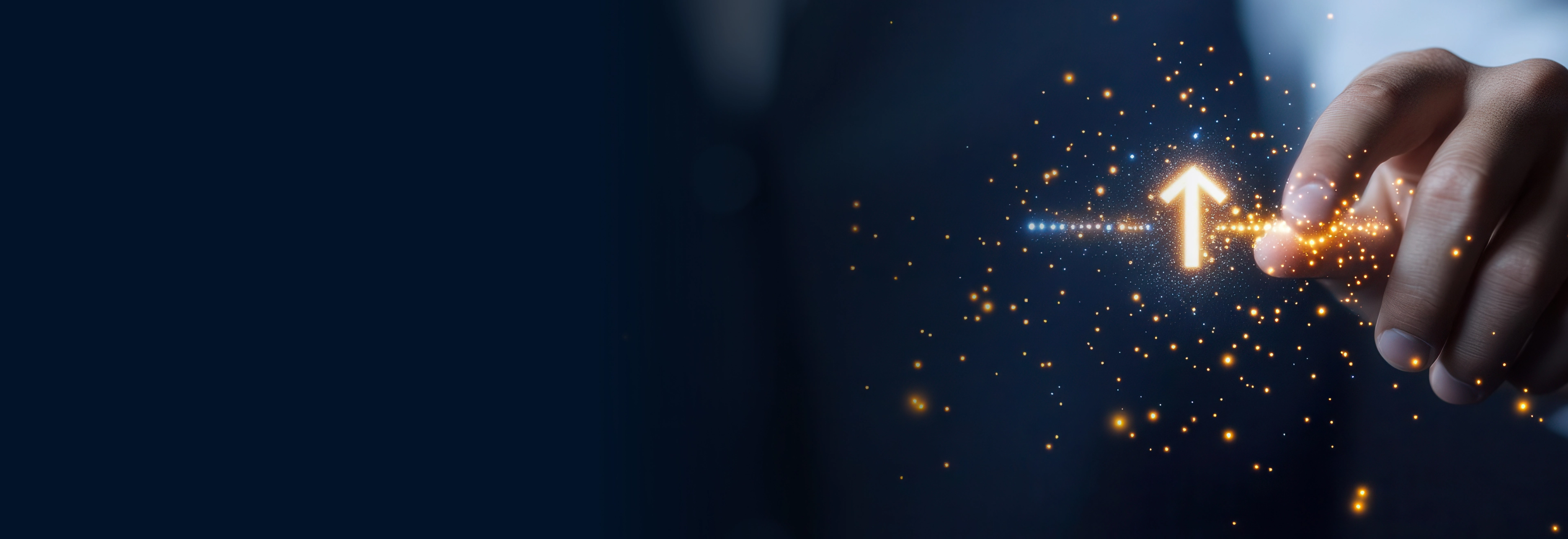 Hand touching luminous upward arrow with golden particles on dark blue background symbolizing digital growth and innovation